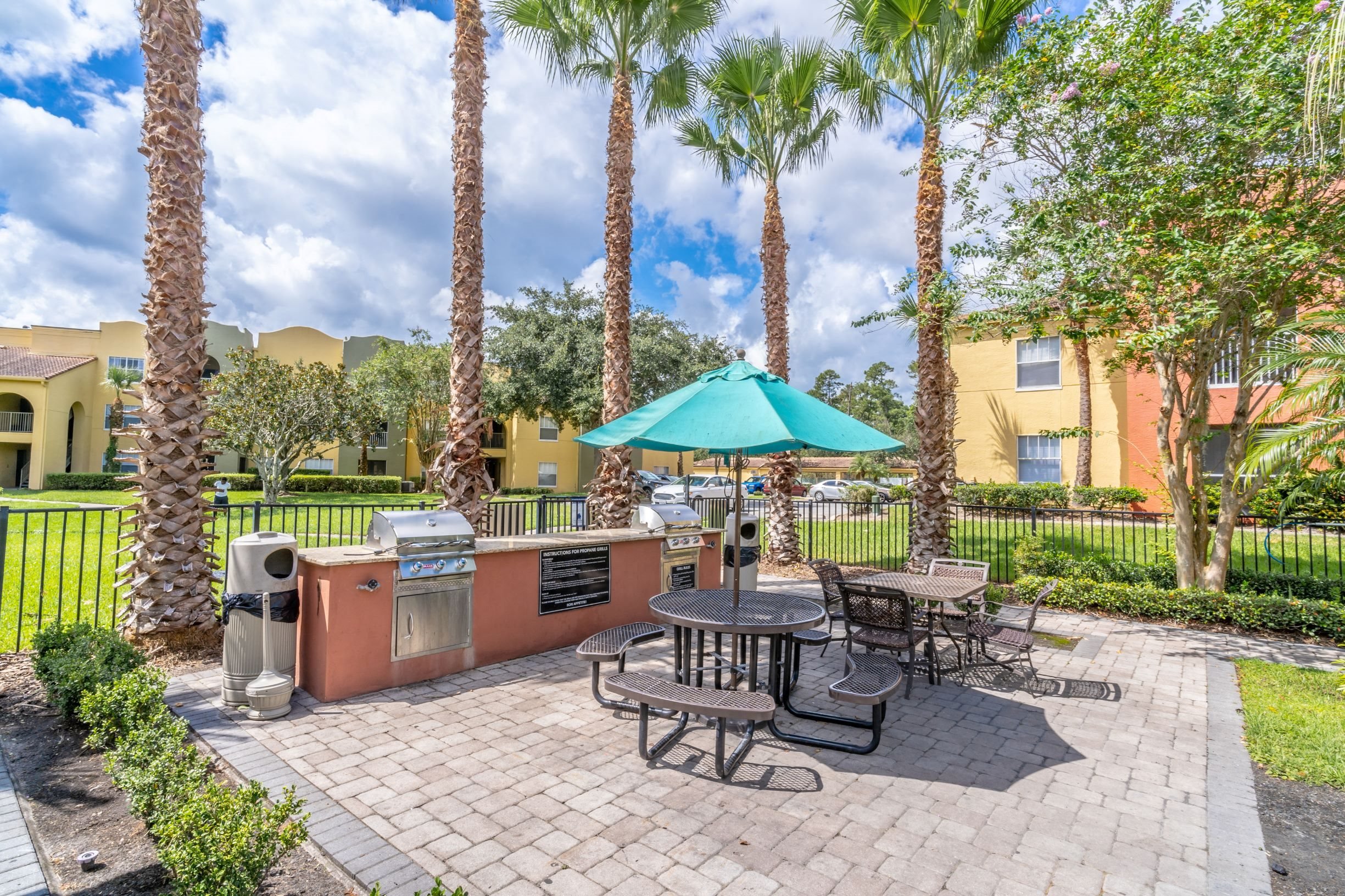 Outdoor Grilling Station at Mission Club Apartments in Orlando, FL